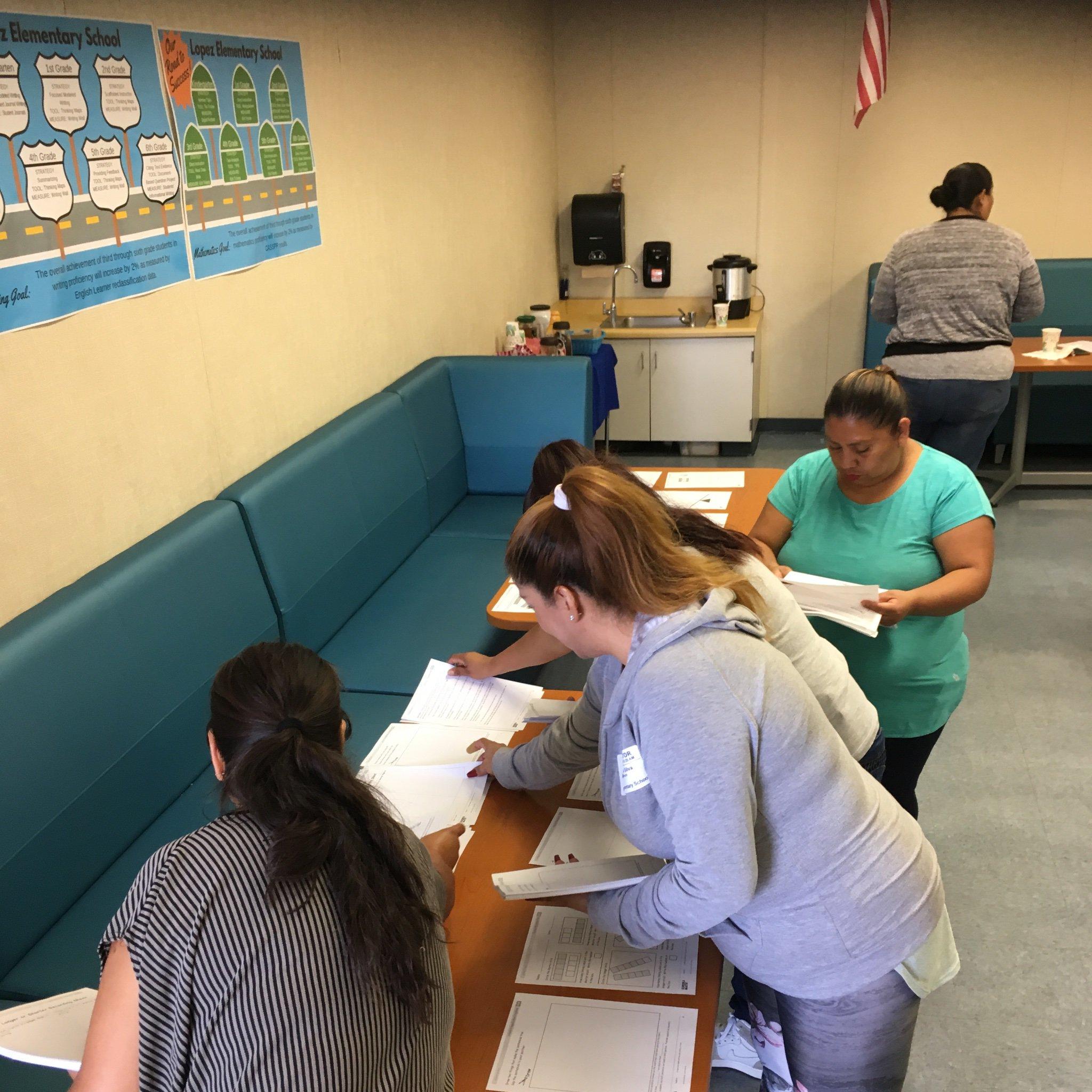 Our Lopez #parents were engaged and learned about the new ELA program, #BenchmarkAdvance, then volunteered to organize #math pages for the #teachers  Thank you for all the support you bring to our school!